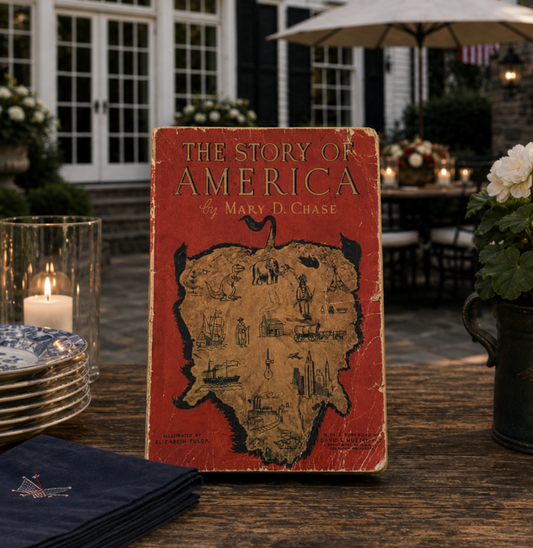 Vintage book titled 'The Story of America' by Mary D. Chase on a table with outdoor setting.