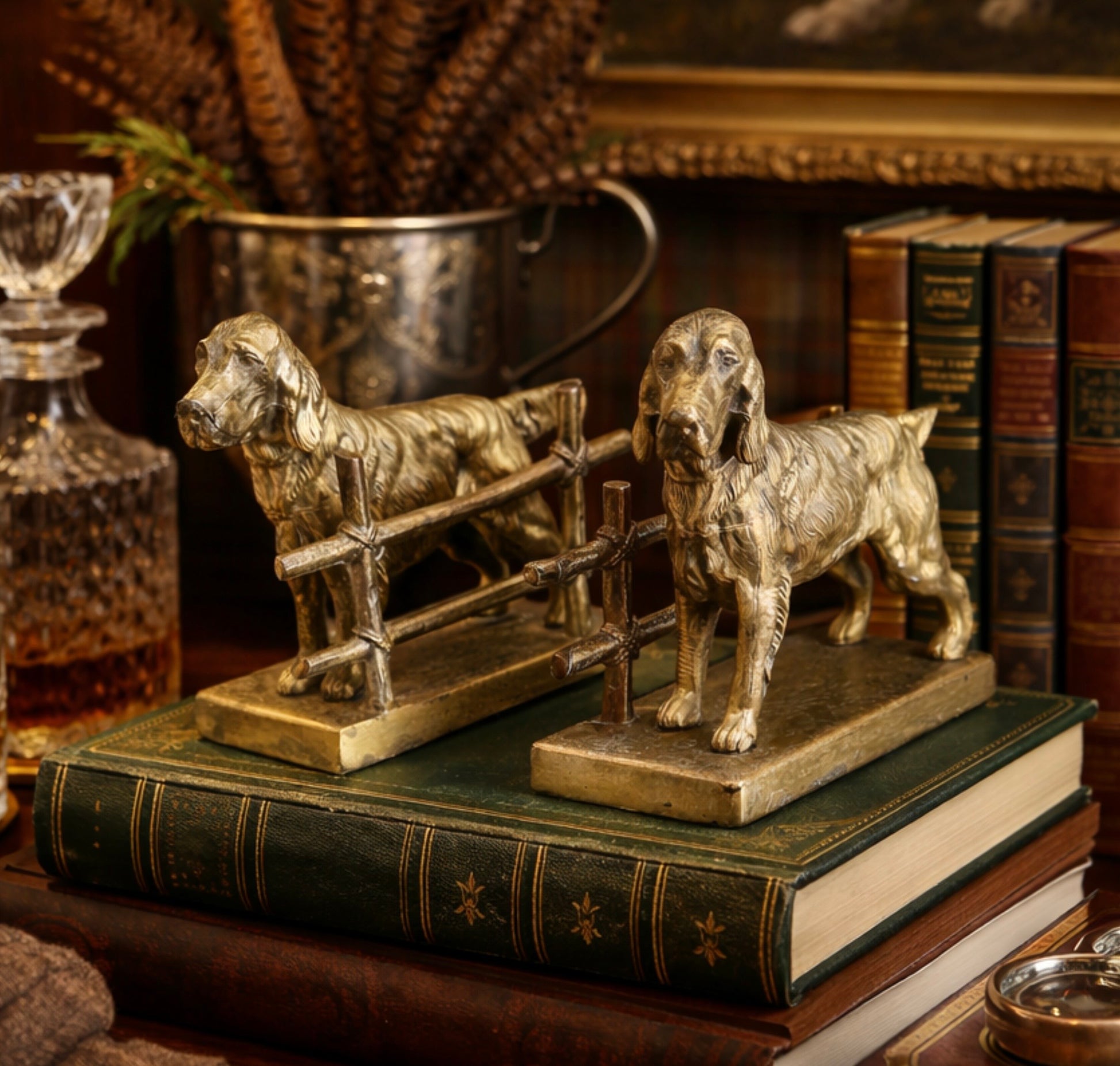 Bronze dog sculptures on vintage books with a decorative background