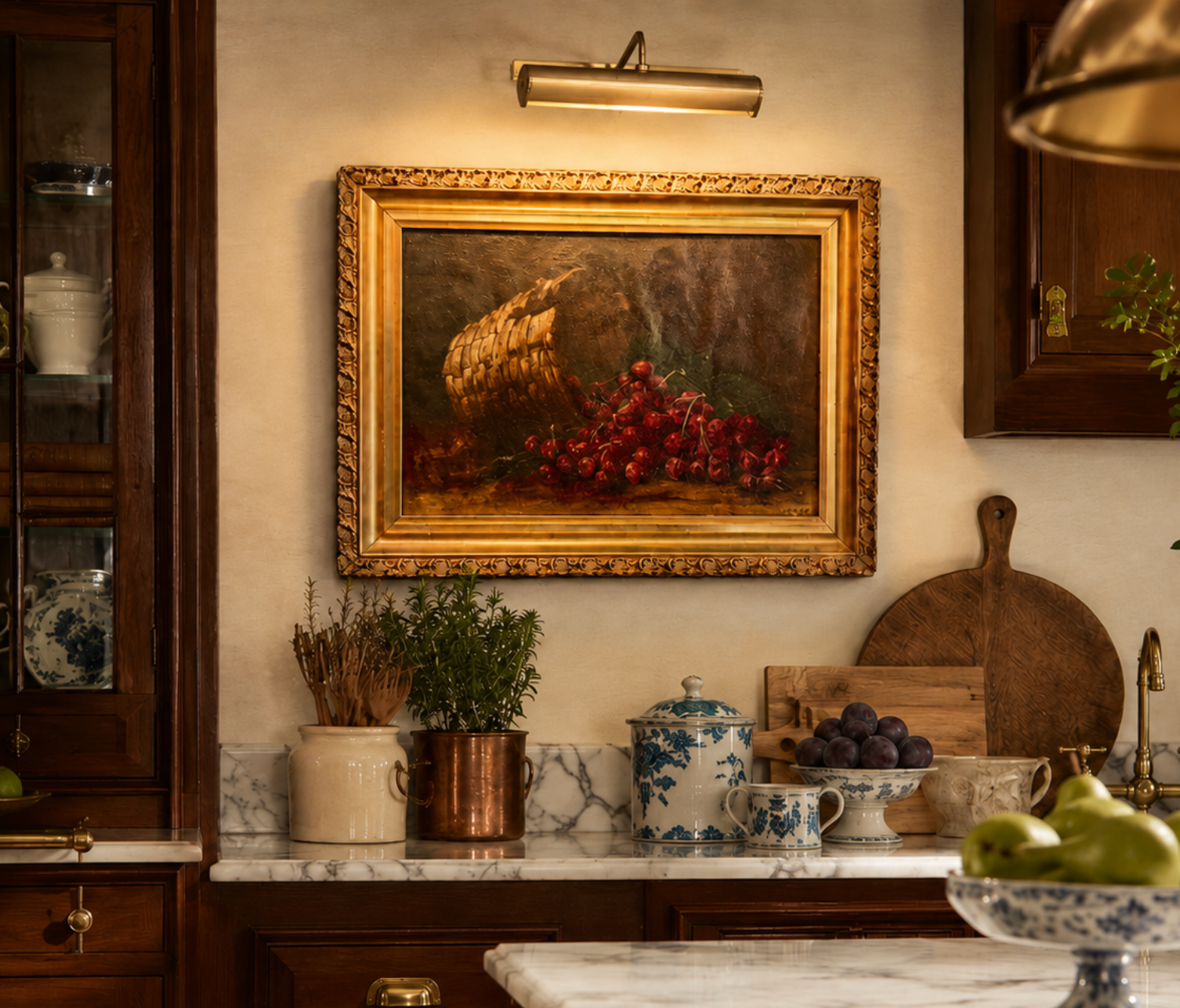 Decorative kitchen with a framed painting of fruit on the wall, marble countertops, and wooden cabinets.