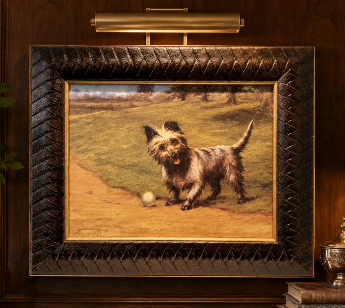 Framed painting of a dog with a ball on a grassy field