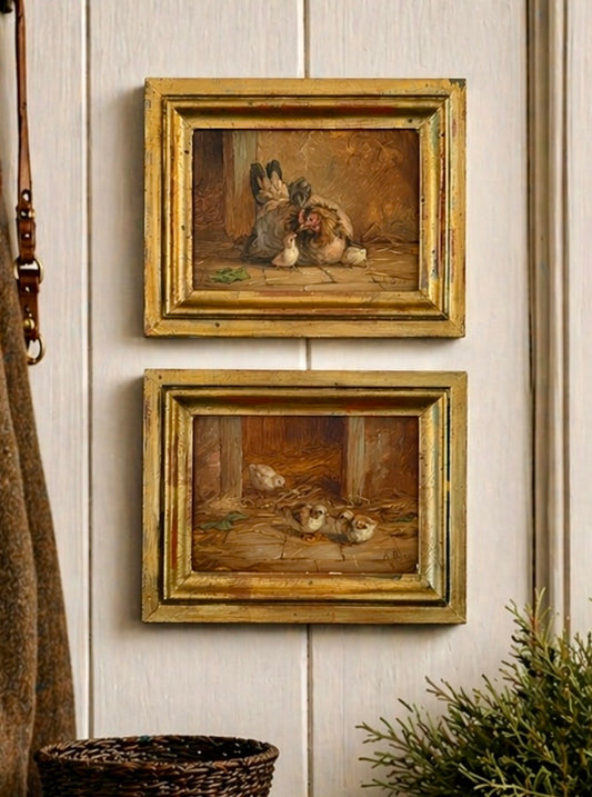 Two framed paintings of animals on a wall with a plant and basket in the foreground.