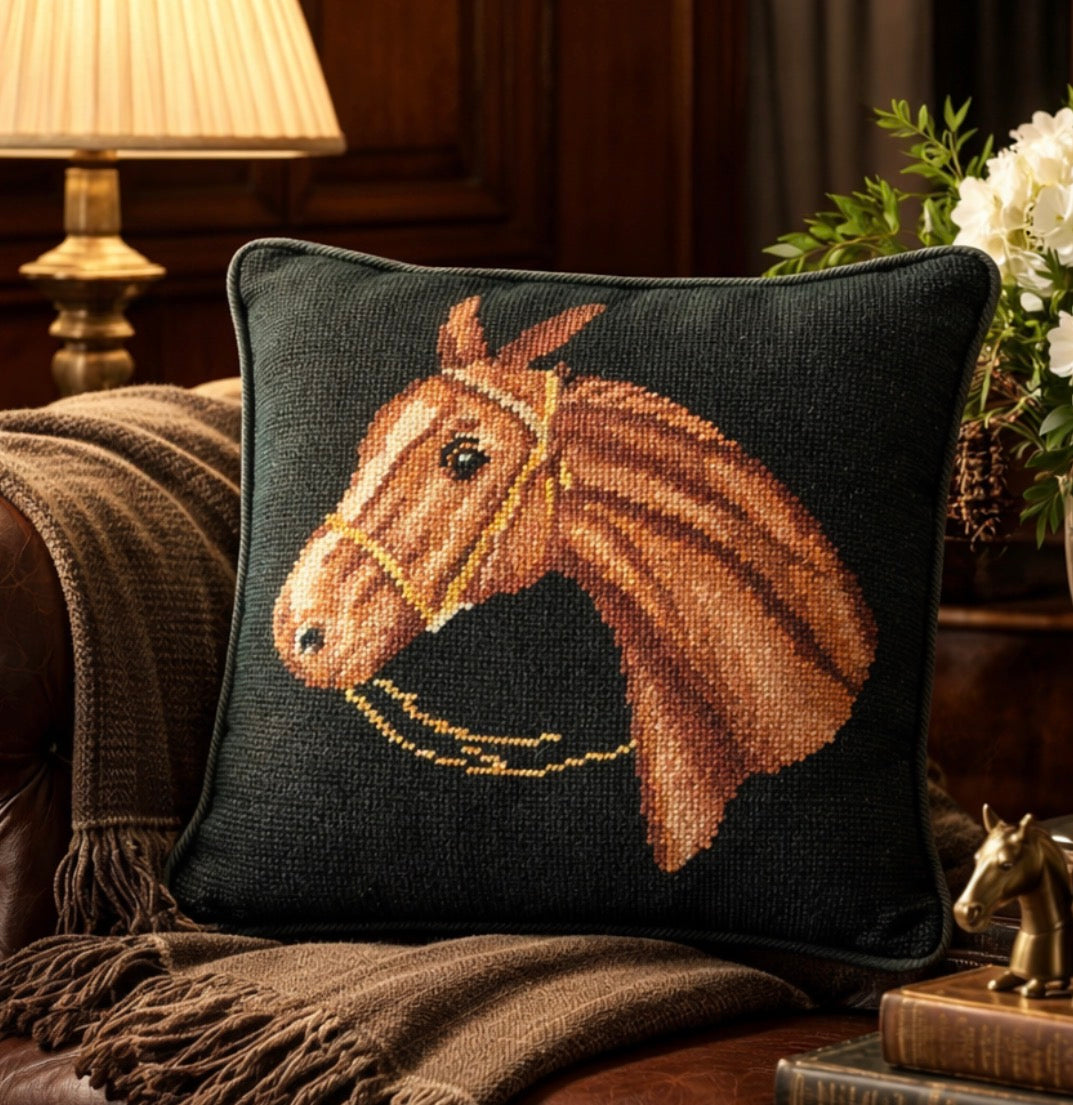 Decorative pillow with horse design on a couch in a cozy living room setting.