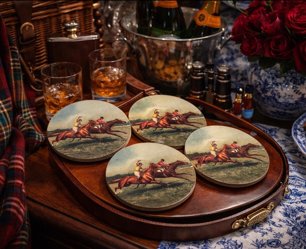 Set of coasters with horse racing design on a wooden tray with drinks and decorative items.