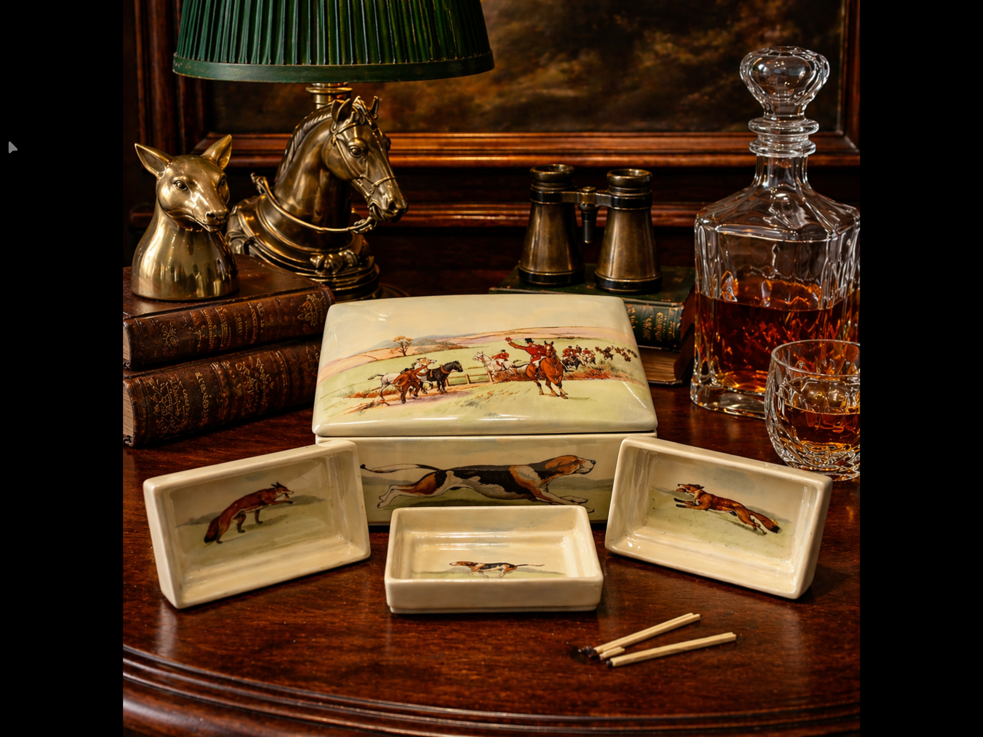 Decorative items including a decanter, books, and trinkets on a wooden surface.