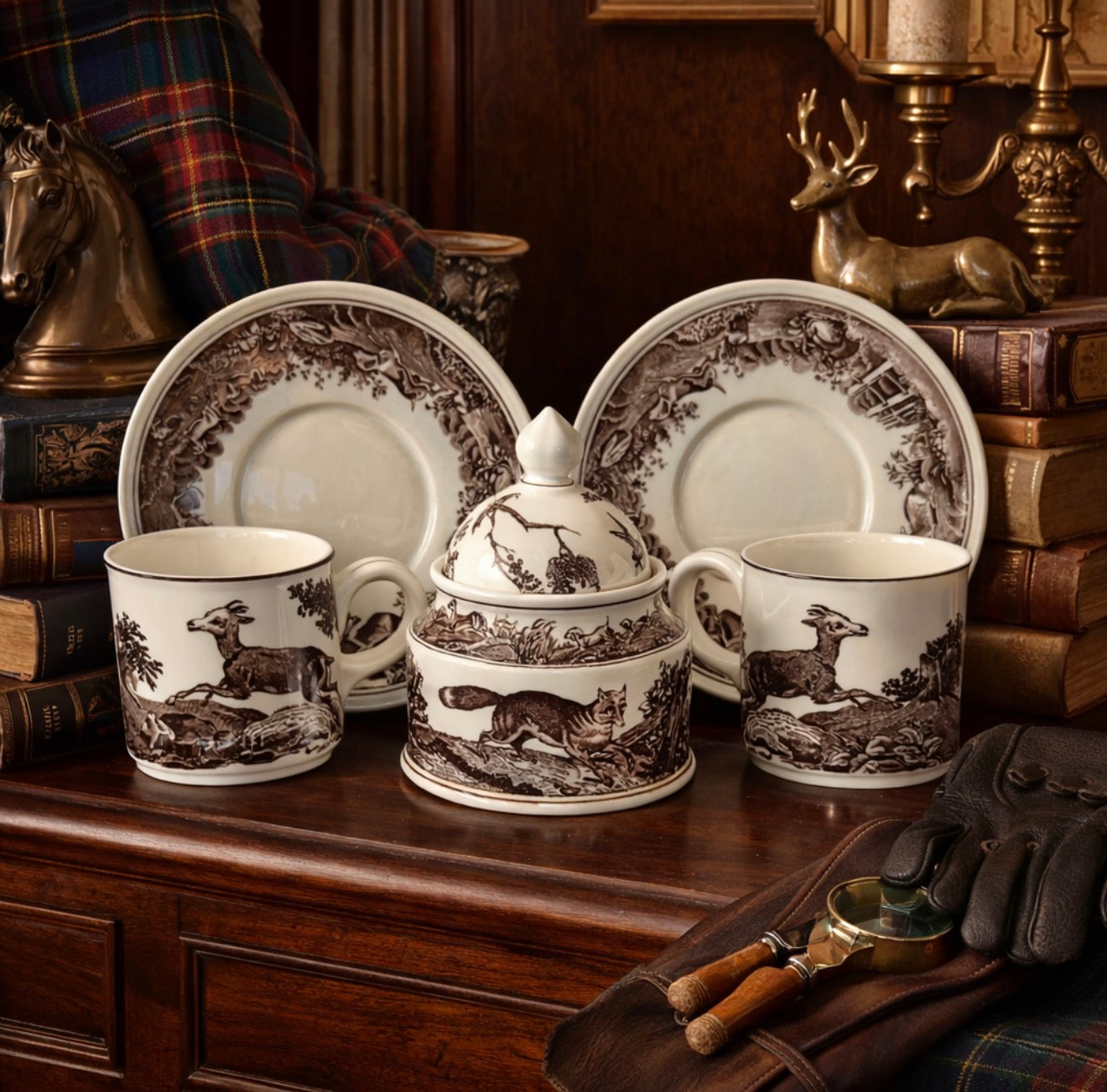 Porcelain set with deer design on a wooden surface