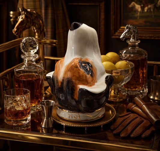 Decorative horse head decanter on a bar with glasses and bottles.